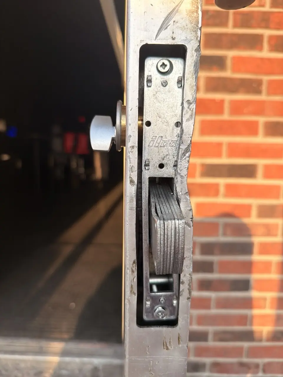 Storefront aluminum door lock opened after a business lockout