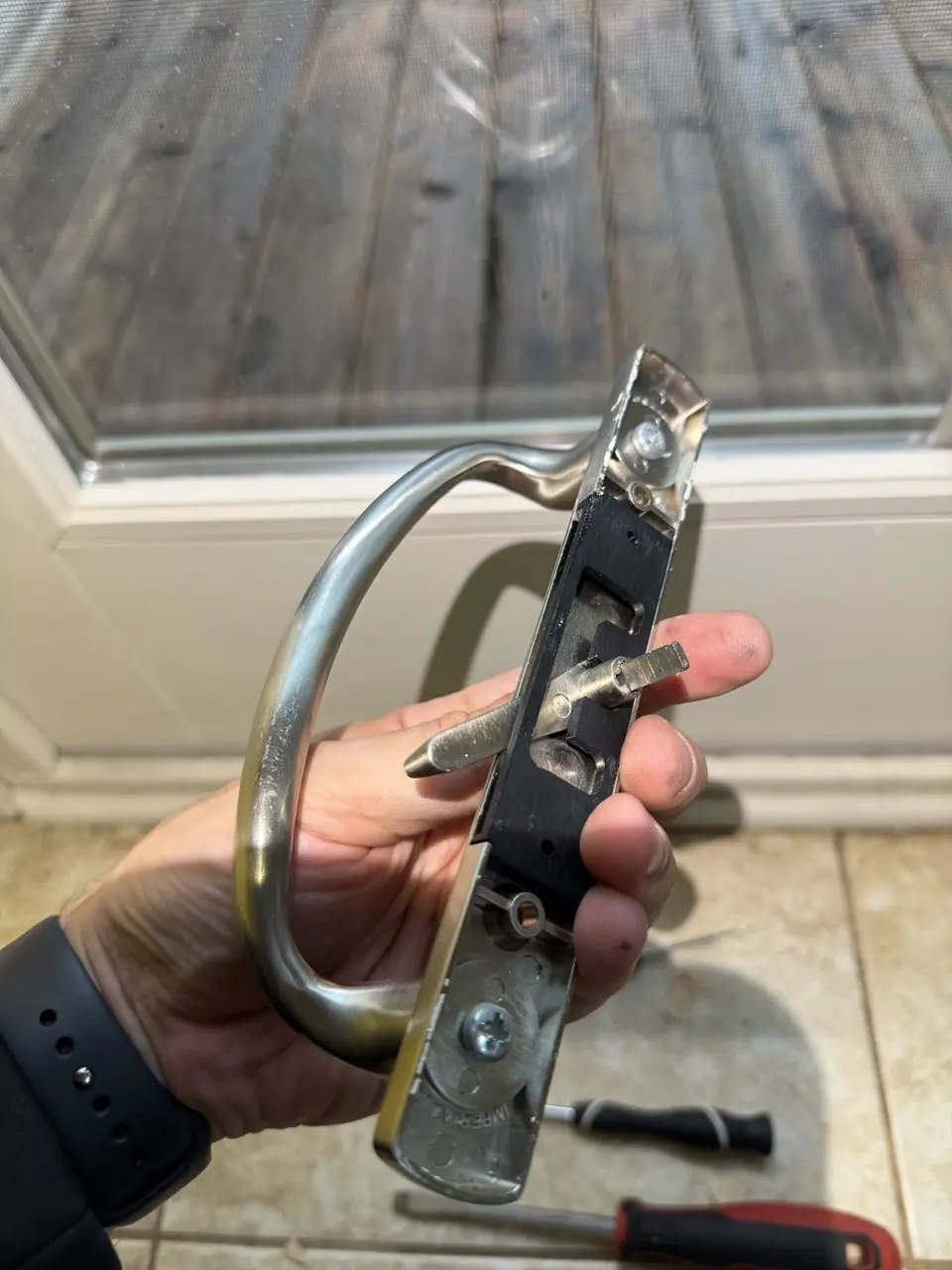 Patio door handle and lock being replaced