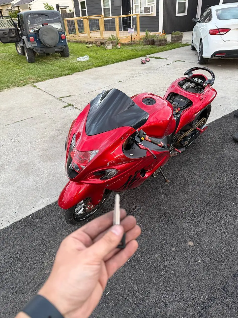 New key made for a red sport bike in the owner's driveway